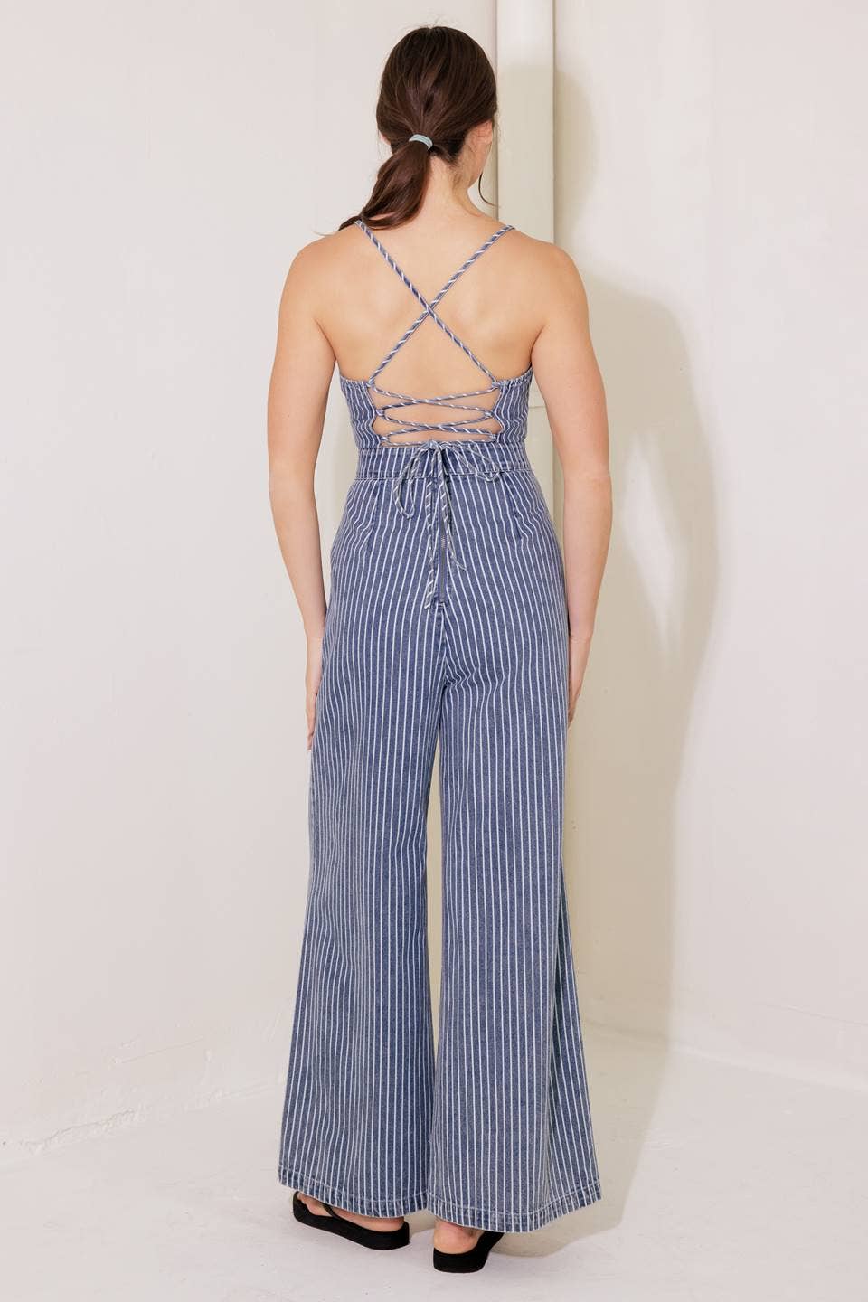 A washed striped denim jumpsuit