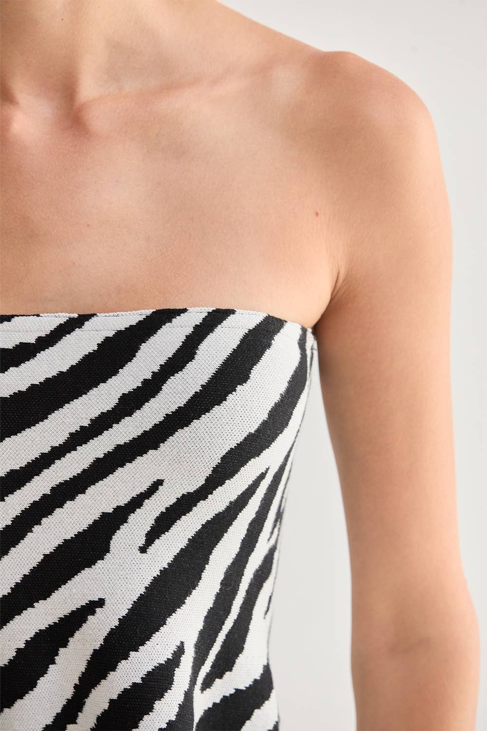 Izzy Zebra Print Jacquard Knit Peplum Top
