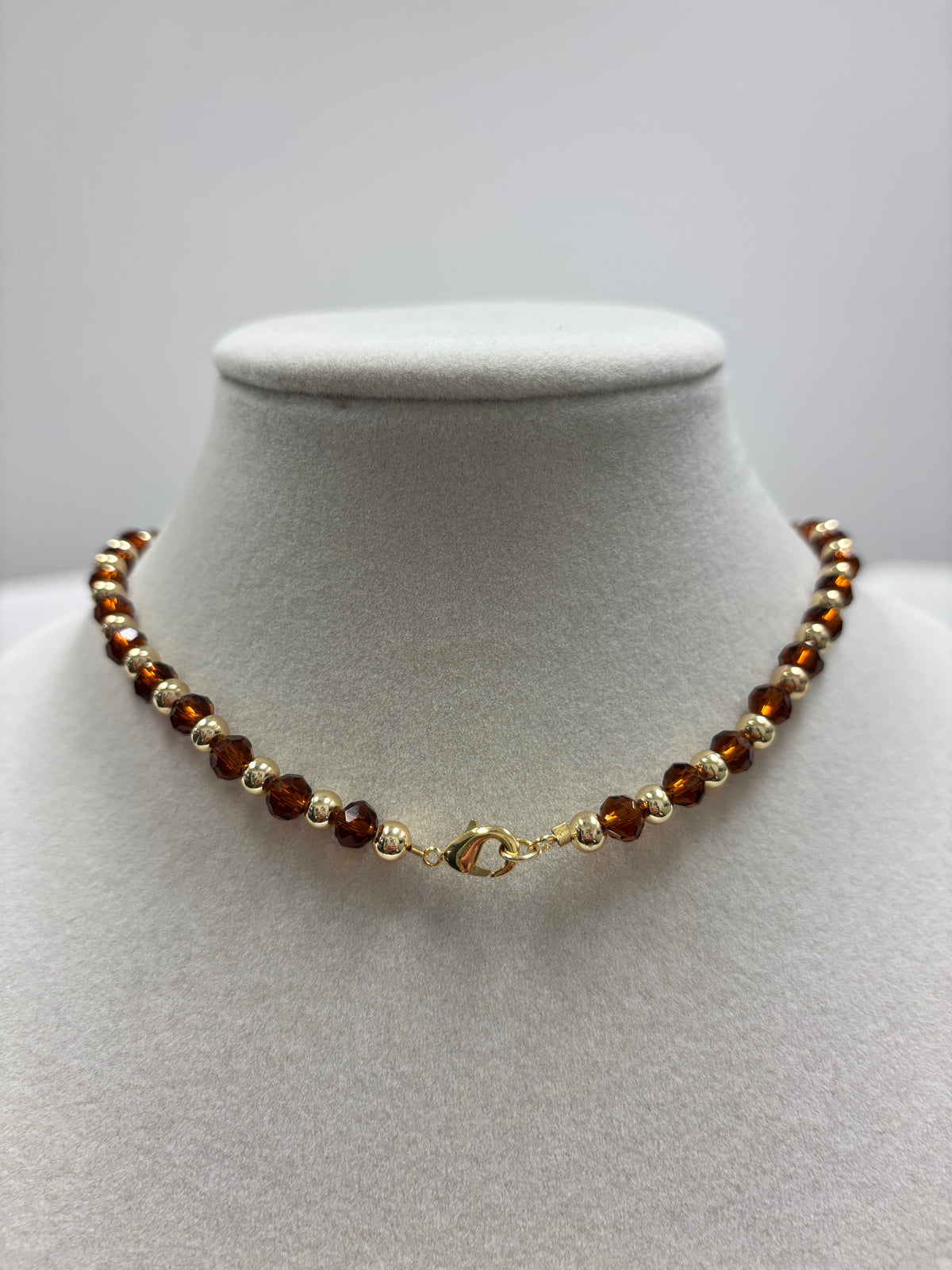 Brown Beads With Shiny Small Gold Charm Necklace