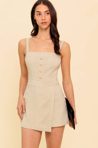 A solid woven romper